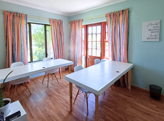 MonteNova tutor room with table and curtains