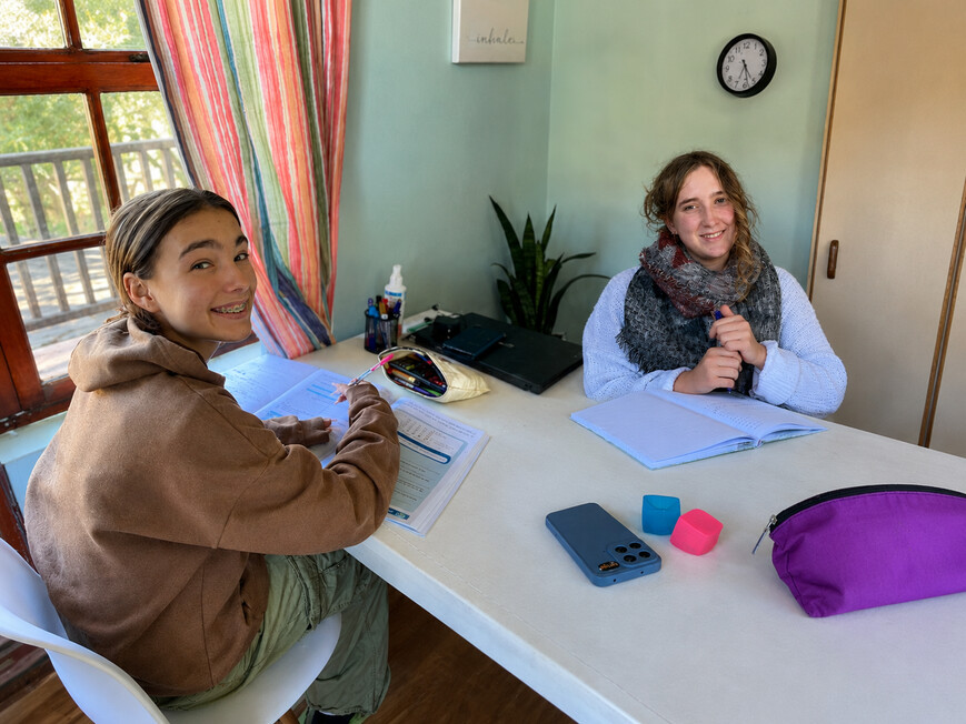 Two learners working with study materials at MonteNova Academy